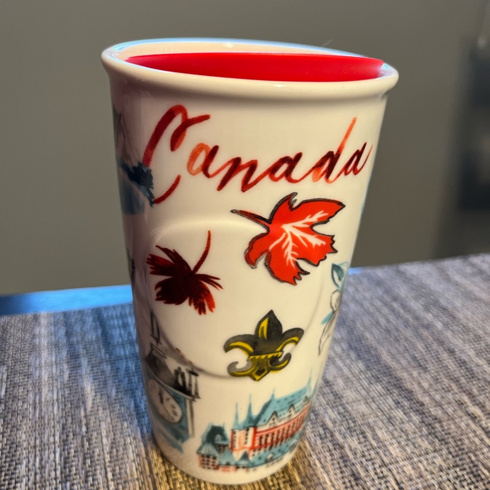 Canada Starbucks “Wish You Were Here” tall mug with red lid.